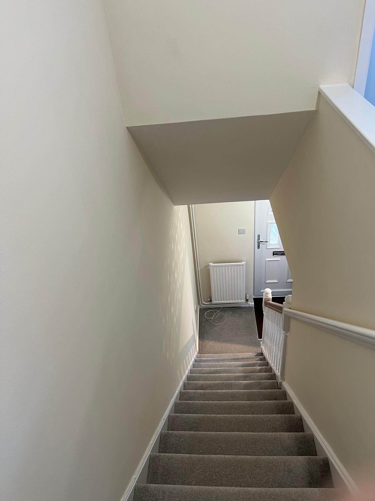Staircase walls freshly painted cream