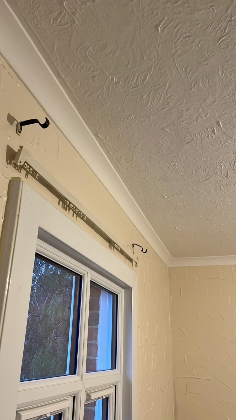 Window with freshly painted walls, coving and textured ceiling