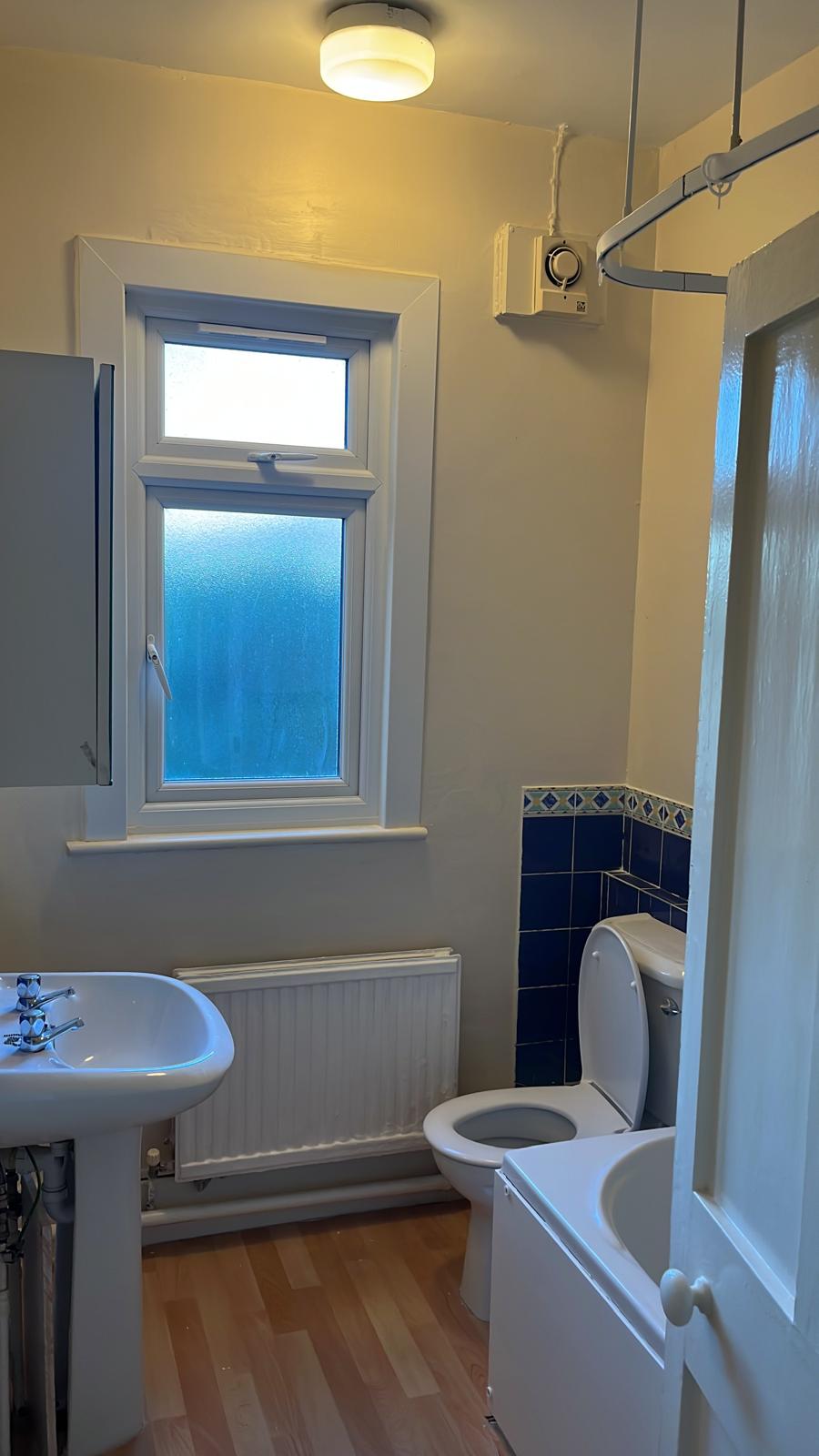Bathroom with freshly painted walls and window frame